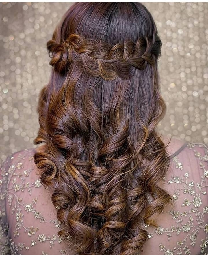 messy half up half down curly hairstyle for saree