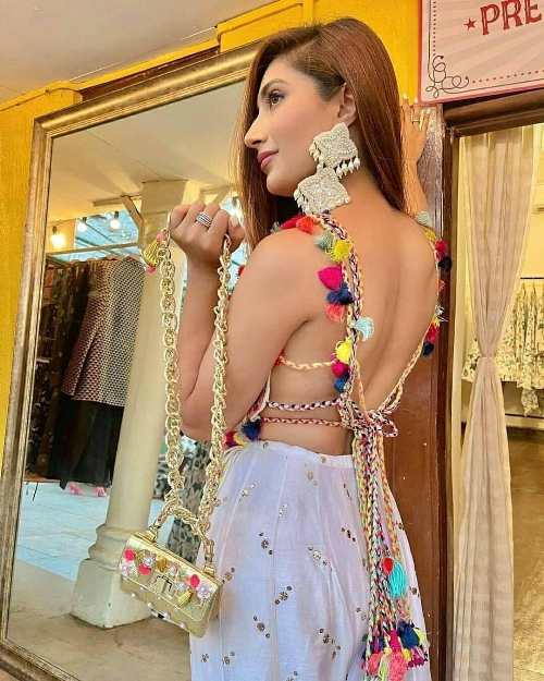 Deep back neck blouse designs with colorful tassel